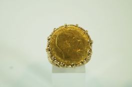 A 1910 half sovereign, in a 9 carat gold ring mount, finger size V,