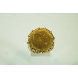 A 1910 half sovereign, in a 9 carat gold ring mount, finger size V,