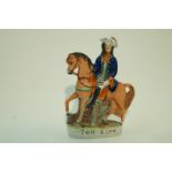 A 19th century Staffordshire pottery figure  of "Tom King" on horseback decorated in coloured