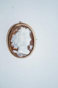 A Victorian gold and oval shell cameo brooch, unmarked,