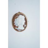 A Victorian gold and oval shell cameo brooch, unmarked,