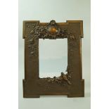 An Edwardian bronze photograph frame with moulded cartouche and birds in branches, 26cm high, 20.