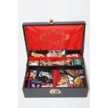 A collection of costume jewellery housed in a jewellery case and a strong box