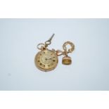 A lady's fob watch, stamped '18k', with gilt metal cuvette,