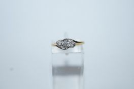 A three stone diamond 9 carat gold ring,