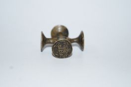 An 18th century brass four way merchants seal