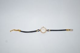 Tudor, A lady's 9 carat gold round wrist watch, circa 1987,