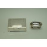 A rectangular silver cigarette box by James Garrard and a Ronson lighter