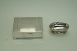 A rectangular silver cigarette box by James Garrard and a Ronson lighter