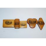 A collection of mid Victorian Mauchline ware, comprising of two pin cushions, one with HMS Victory,