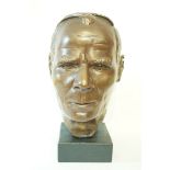 A late 20th century plaster bust of a gentleman with bronze patination,