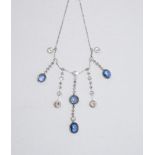 A sapphire and diamond fringe necklace, the graduated drops set with four cabochon sapphires,