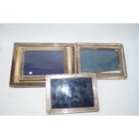 A silver photograph frame, import marks for 1975, the plain frame 20.5cm by 15.