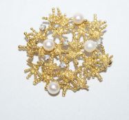 A cultured pearl and diamond brooch, stamped '18ct',