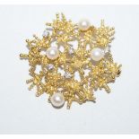 A cultured pearl and diamond brooch, stamped '18ct',