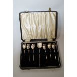 A set of six silver coffee spoons and sugar spoon, London 1972, larger spoon by C. J.