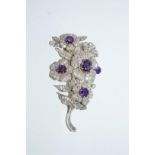 A diamond and amethyst Victorian style foliate spray brooch, set throughout with old brilliant cuts,