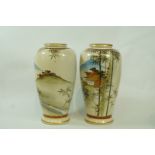 A pair of 20th century Japanese earthenware vases, each painted with a landscape,