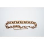 A bracelet of facetted belcher links with a T bar and swivel clasp, 22cm long,