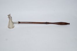 A Brian Fuller silver rabbit candle snuffer, London 1979, on a turned wooden handle,