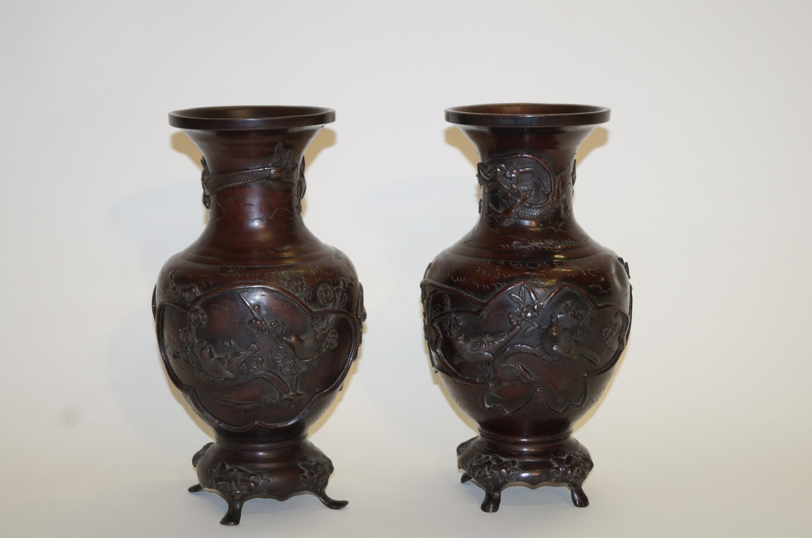 A pair of bronze patinated Japanese vases,