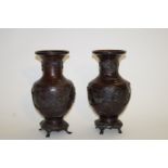 A pair of bronze patinated Japanese vases,