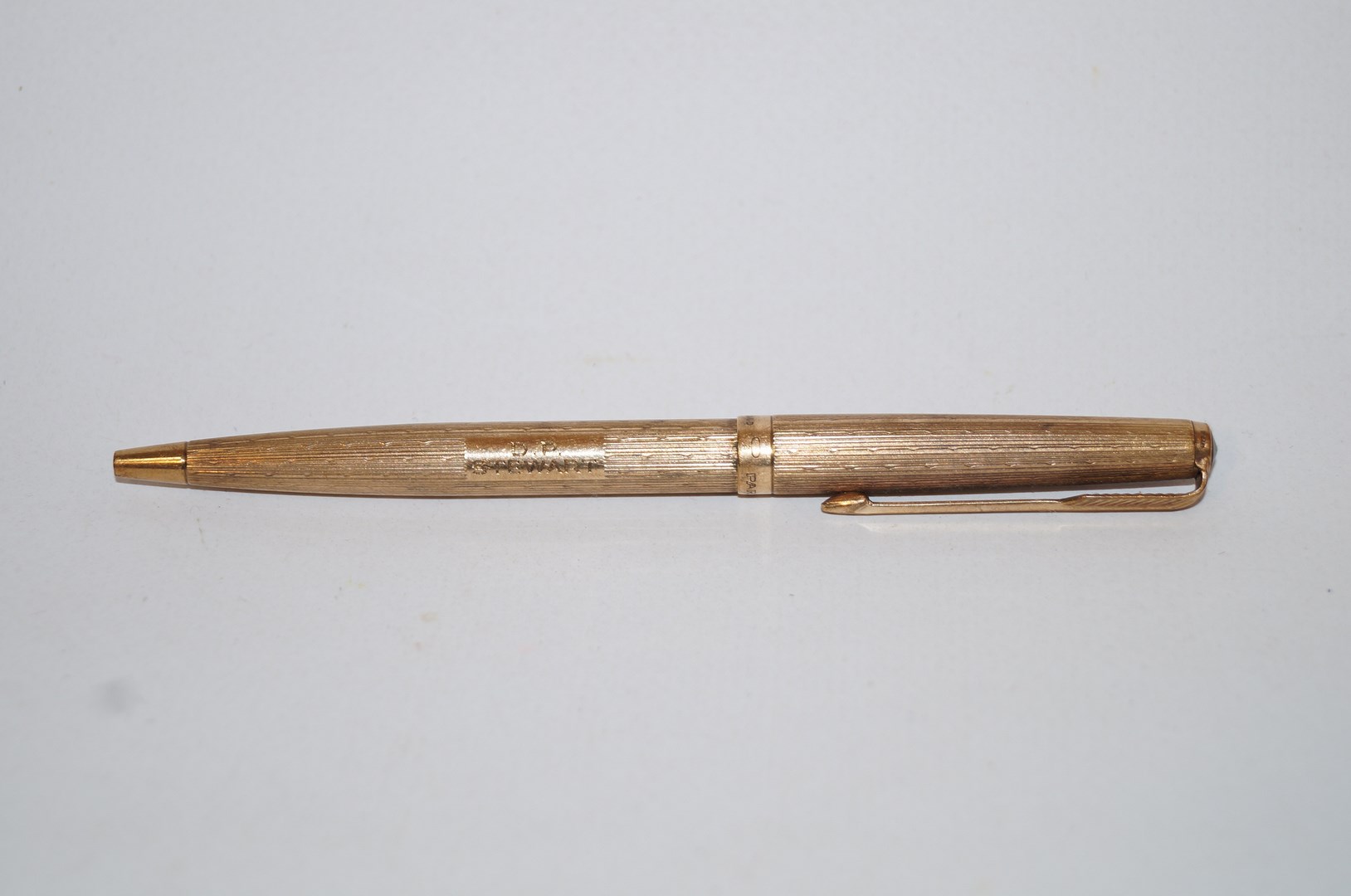 A 9 carat Parker pen, with engine turned decoration,