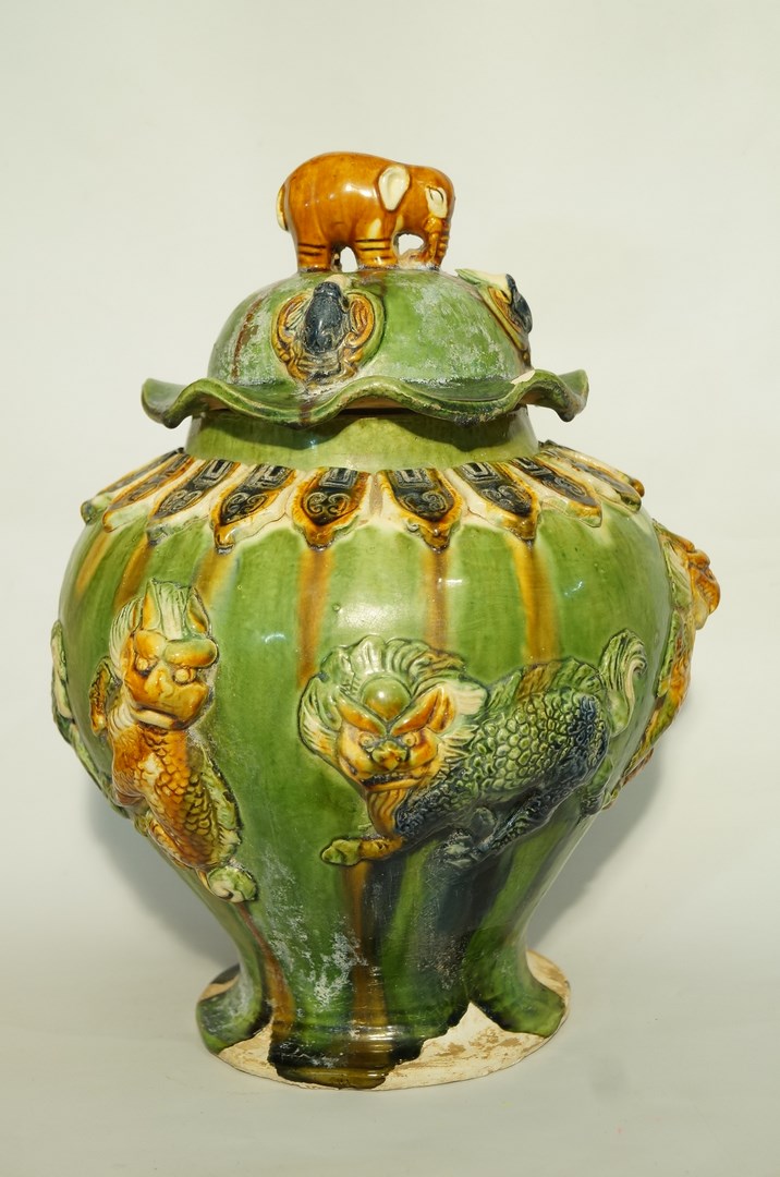 A Sancai style vase and cover, with elephant finial,