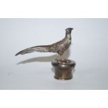 A silver bottle stopper, John Figg & Son, London import mark 1972, the finial cast as a pheasant,