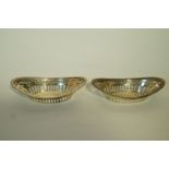 A pair of silver bon bon dishes, Walker & Hall, Birmingham 1911, of pierced boat shape form,