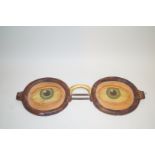 A pair of early 20th century carved wood and painted advertising spectacles,