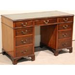 An Edwardian mahogany twin pedestal desk