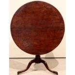 A George III mahogany tilt top table wit