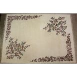 A cream ground Indian carpet with floral