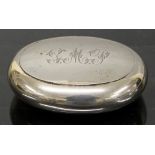 A silver snuff box of oval form with gol