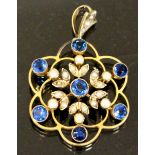 A 9ct gold pendant decorated with seed p