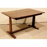 An Arts and Crafts elm table (141 x 90 x