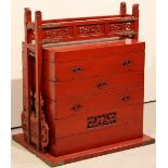 A Chinese red lacquer marriage cabinet o