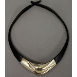 A Lapponia silver and leather necklace.