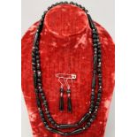 A banded Agate opera length necklace wit