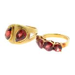 Collection of Garnet, 14k Yellow Gold Rings. Including one ring featuring two pear-cut garnets set