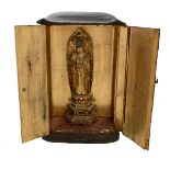 A Japanese Gilt-Lacquer Wood Buddhist Shrine  The shrine with hinged double doors opening to