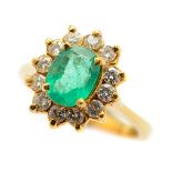Emerald, Diamond, 14k Yellow Gold Ring. Centering one oval-cut emerald weighing approximately 0.85