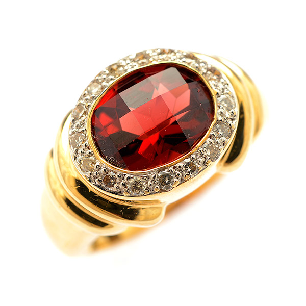 Garnet, Diamond, 14k Yellow Gold Ring. Centering one oval-cut faceted-topped garnet measuring