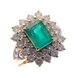 Emerald, Diamond, 18k Yellow Gold Ring. Centering one emerald-cut emerald weighing approximately 1.