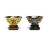 Two Polychrome-Glazed and Silver-Lined Wine Cups Both molded with small bird medallions