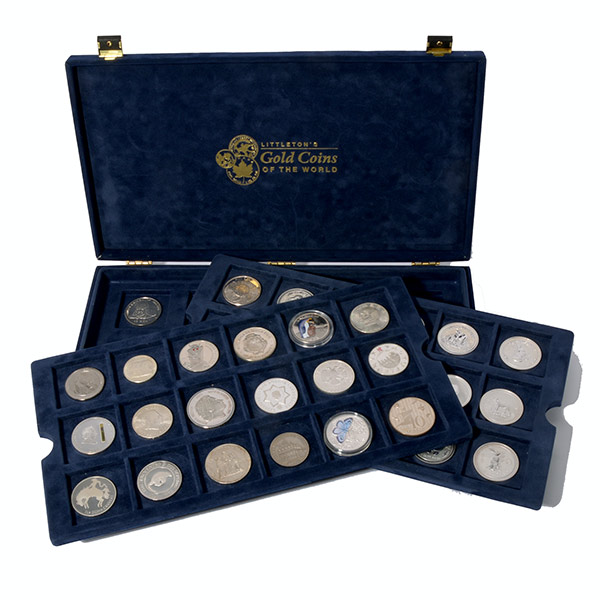 Collection of 50 Silver Coins of the World.   In a blue presentation box.