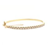 Diamond, 14k Yellow Gold Bracelet. Featuring twenty full-cut diamonds weighing a total of