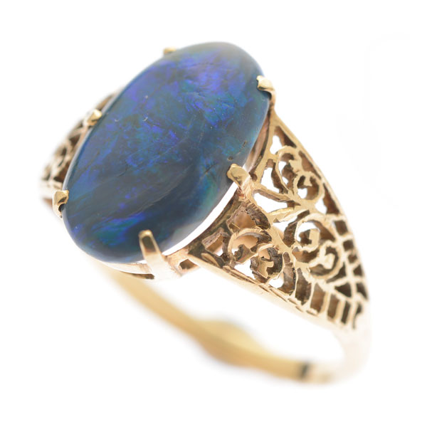 Black Opal, 14k Yellow Gold Ring. Featuring one oval shaped black opal cabochon measuring