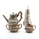 Assembled Group of Four Rococo Revival Silver Repousse Tea Wares: Comprising a Howard & Co, New York